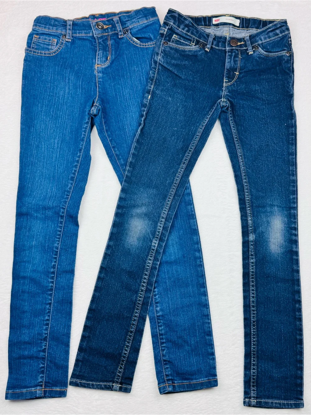 Lot of 2 jeans for girls. 1 is a size 7 Slim, 1 is is a size 8 super skinny